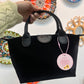Bolso negro polipiel efecto terciopelo y asas de cuero