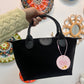 Bolso negro polipiel efecto terciopelo y asas de cuero